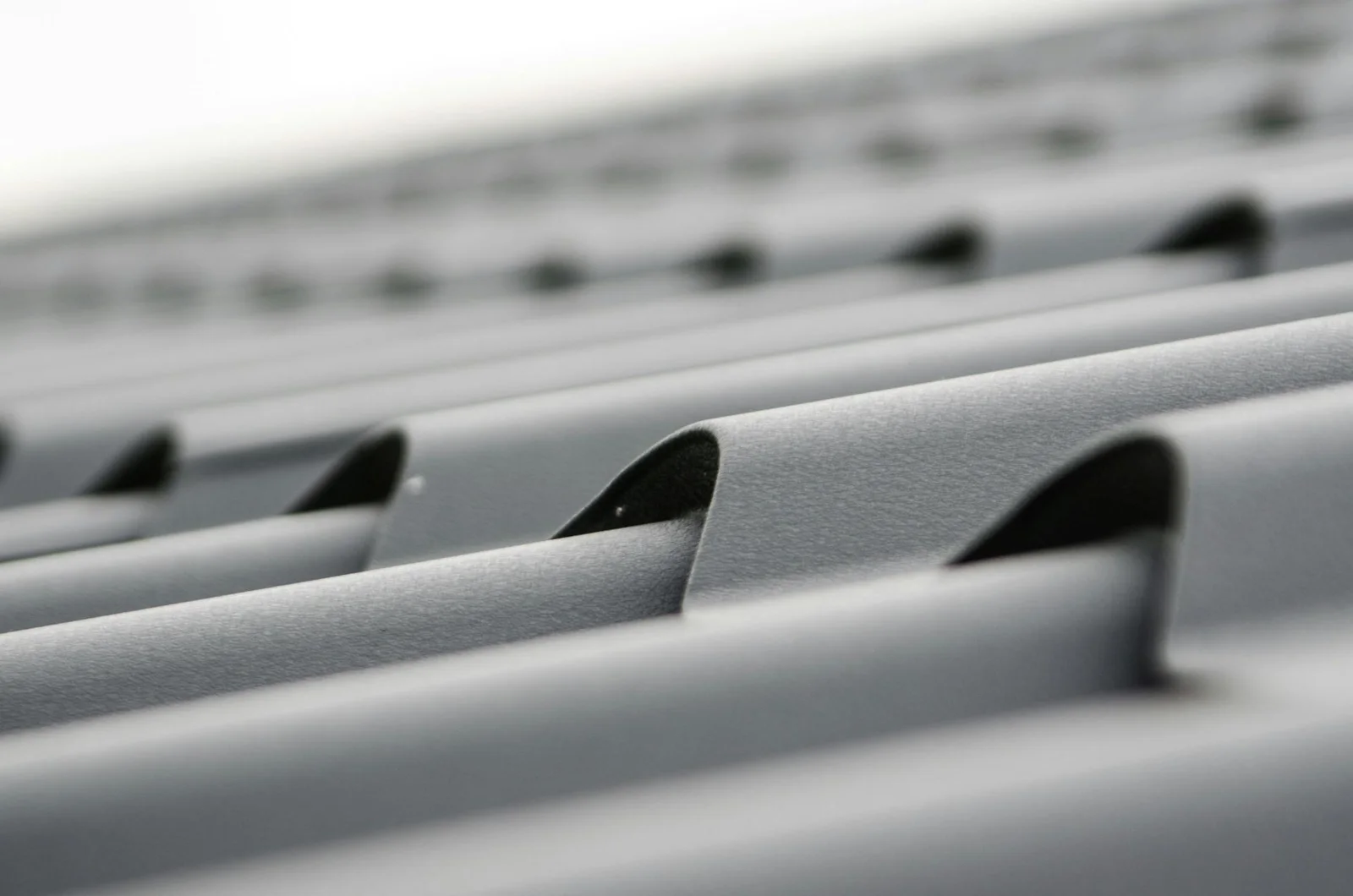 Close-up of gray metal roof tile panels